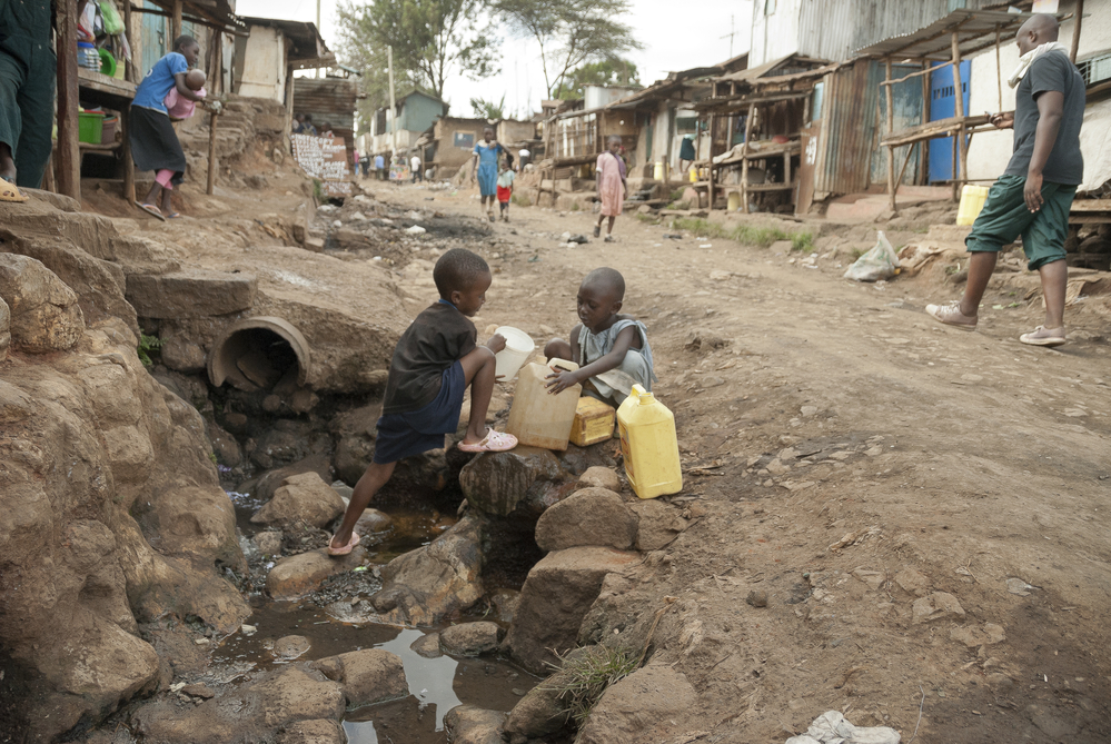 boys collecting water